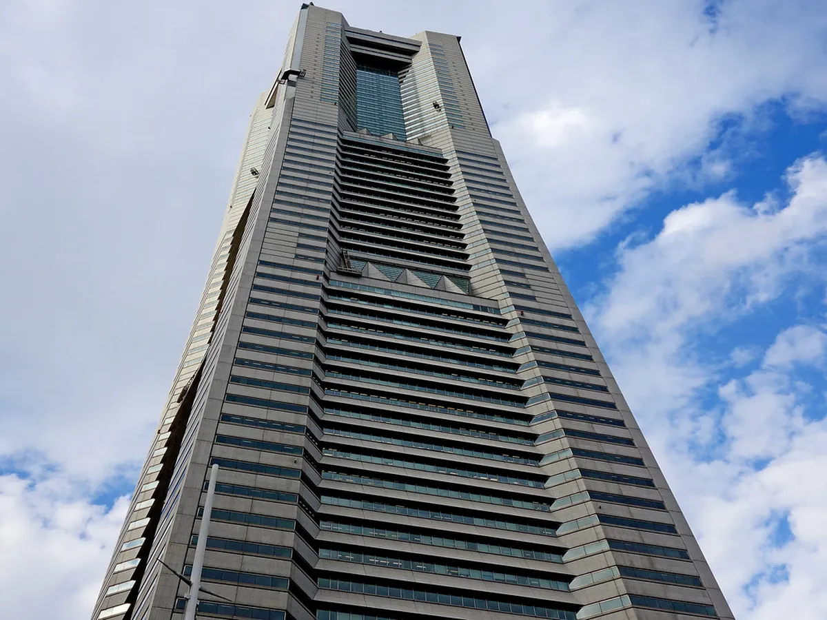 Yokohama Landmark Tower rising above the Minato Mirai 21 district skyline seen from the harbor