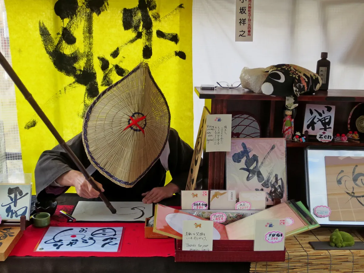 Vendors and stalls lining the eastern bank of the Miyagawa River at the Miyagawa Morning Market in Takayama