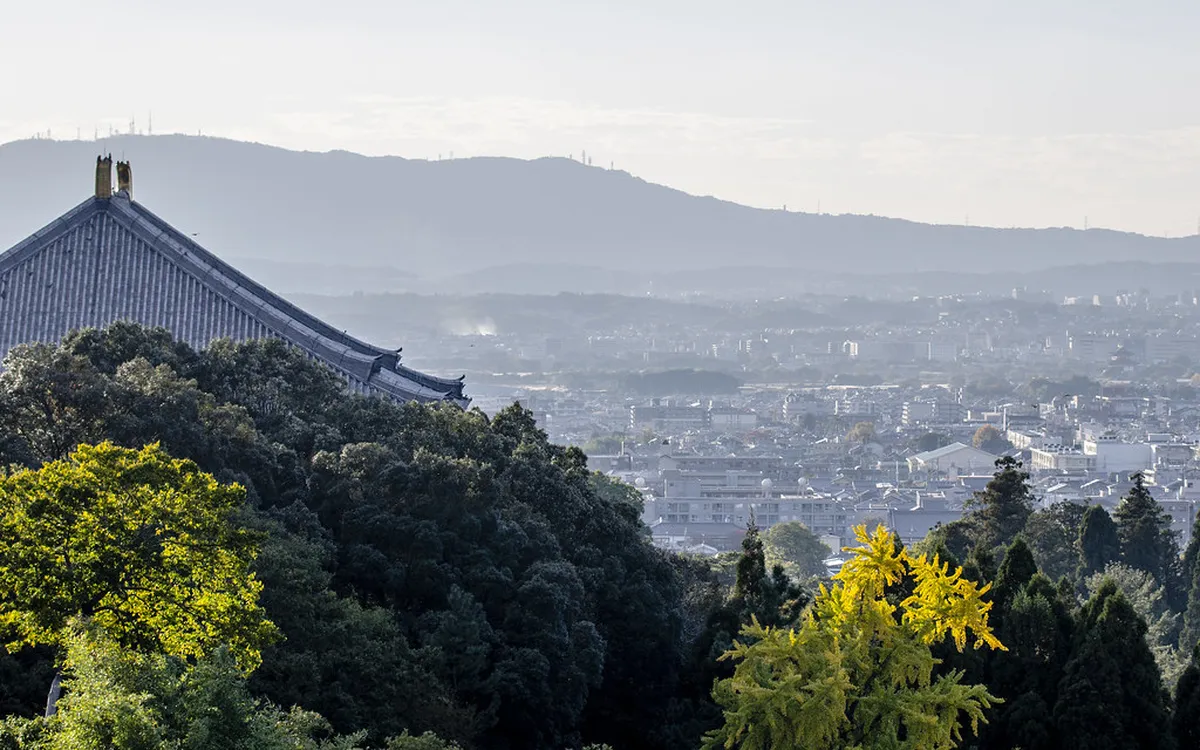 Panoramic view from Mount Wakakusa hillside over Todai-ji rooftops and Nara city in Japan