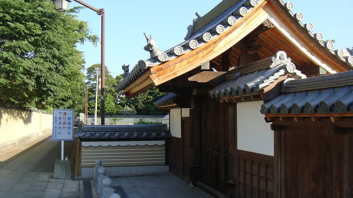 Ancient Shofukuji Zen temple gate and stone path in Hakata old town district of Fukuoka, Japan