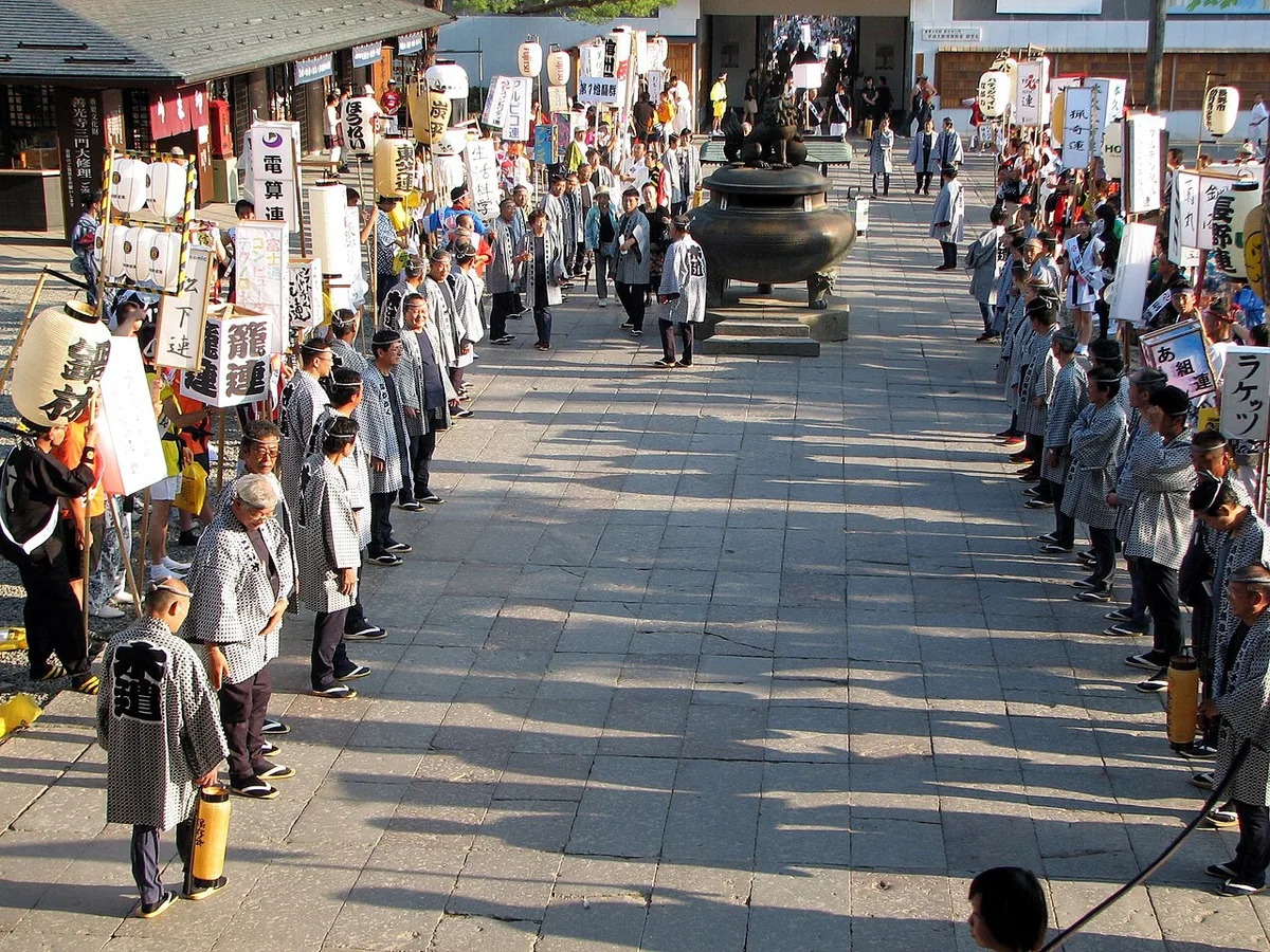Dancers with shamoji fill Chuo-dori during Nagano Binzuru, Japan — 1
