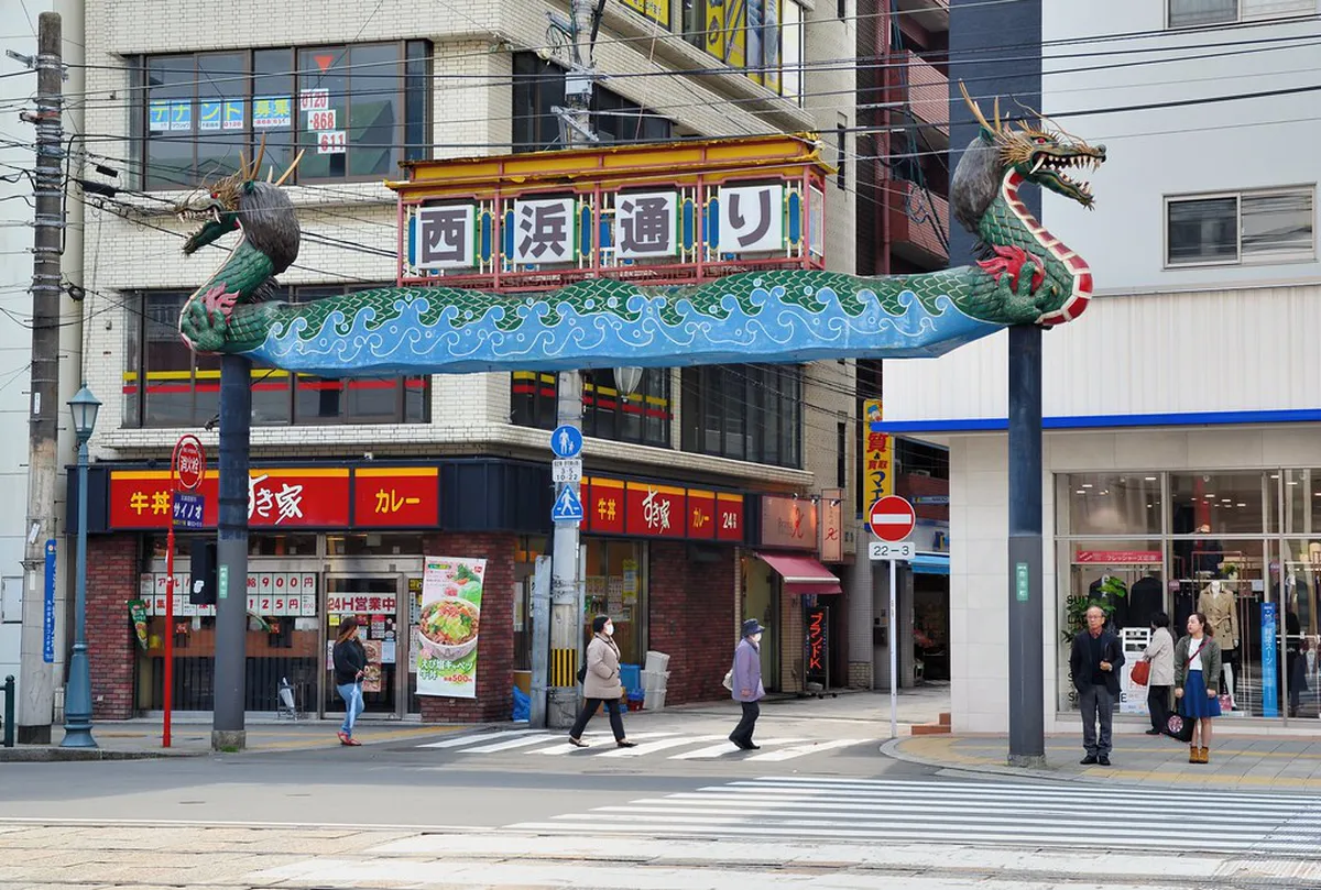 Nagasaki Shinchi Chinatown entrance gate decorated with red lanterns and traditional Chinese motifs, Japan