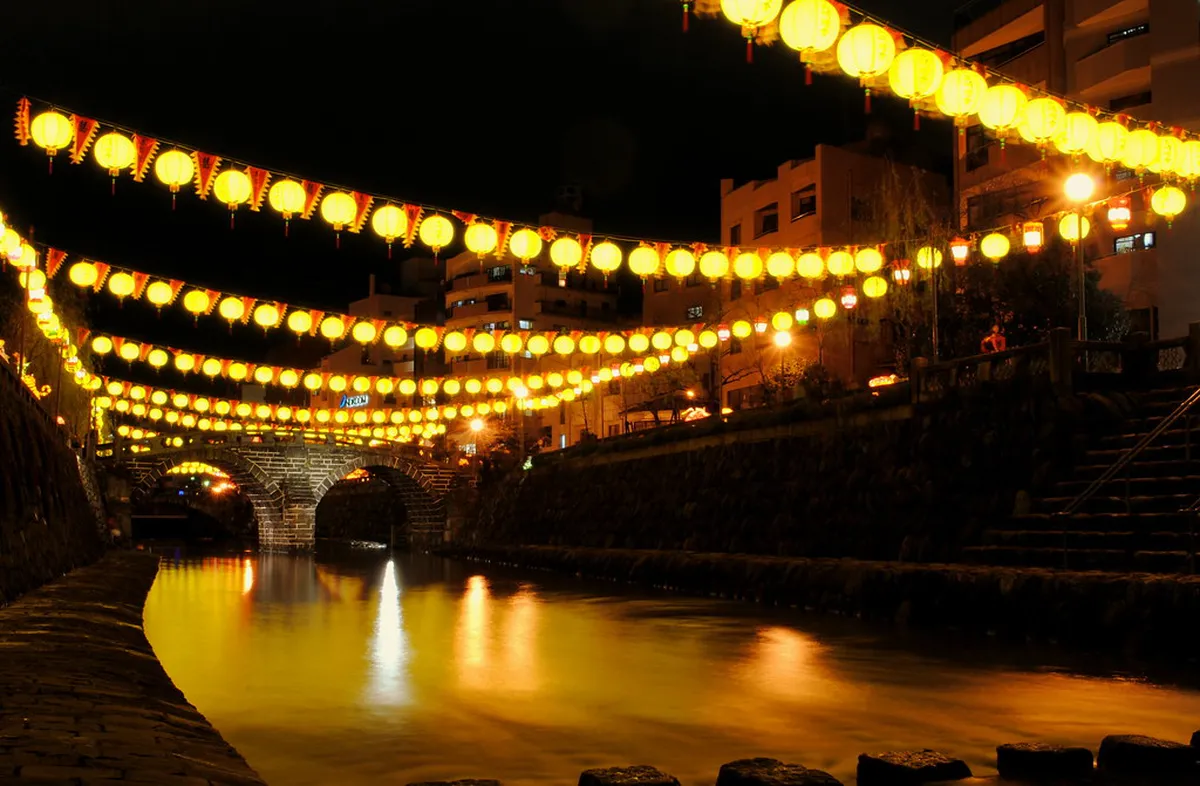 Nagasaki Lantern Festival illumination with thousands of red and gold lanterns lighting the Chinatown streets at night, Japan