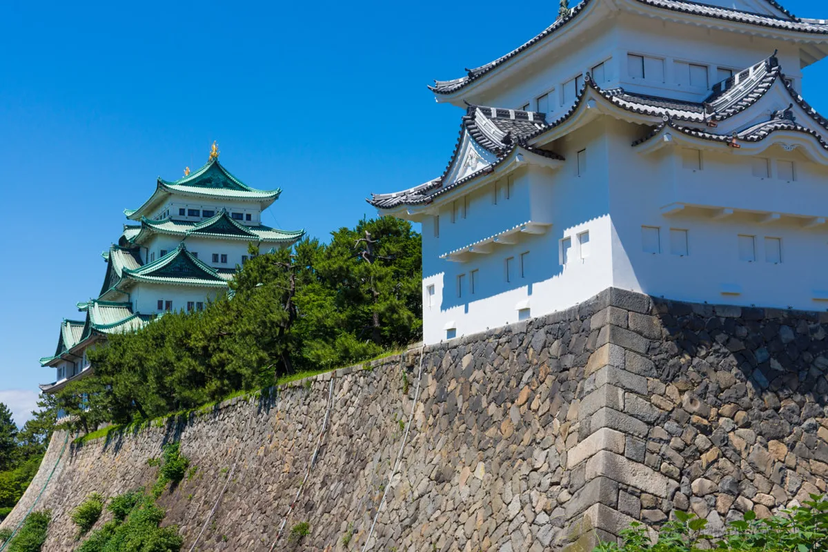 Nagoya Castle’s iconic white keep and traditional rooflines set against a clear sky, the most recognizable landmark attraction in Nagoya, Japan