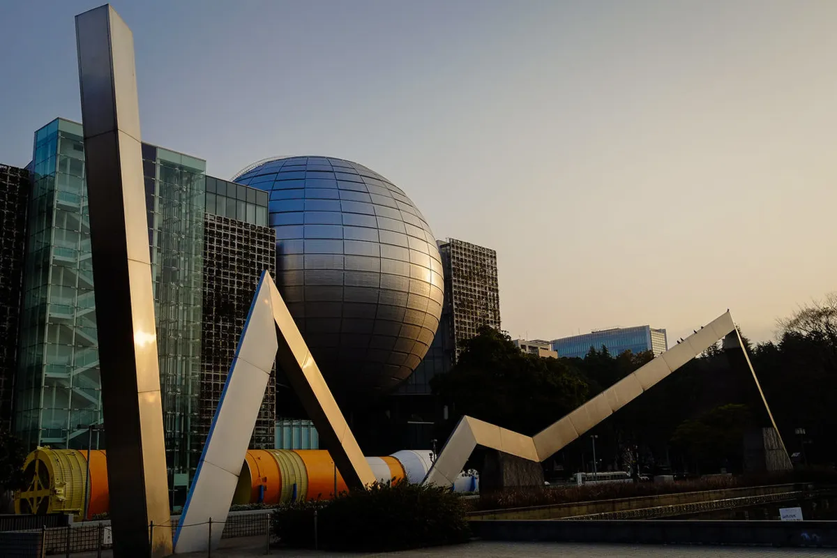 Nagoya City Science Museum iconic silver sphere rising above Shirakawa Park in Sakae, Nagoya, Japan