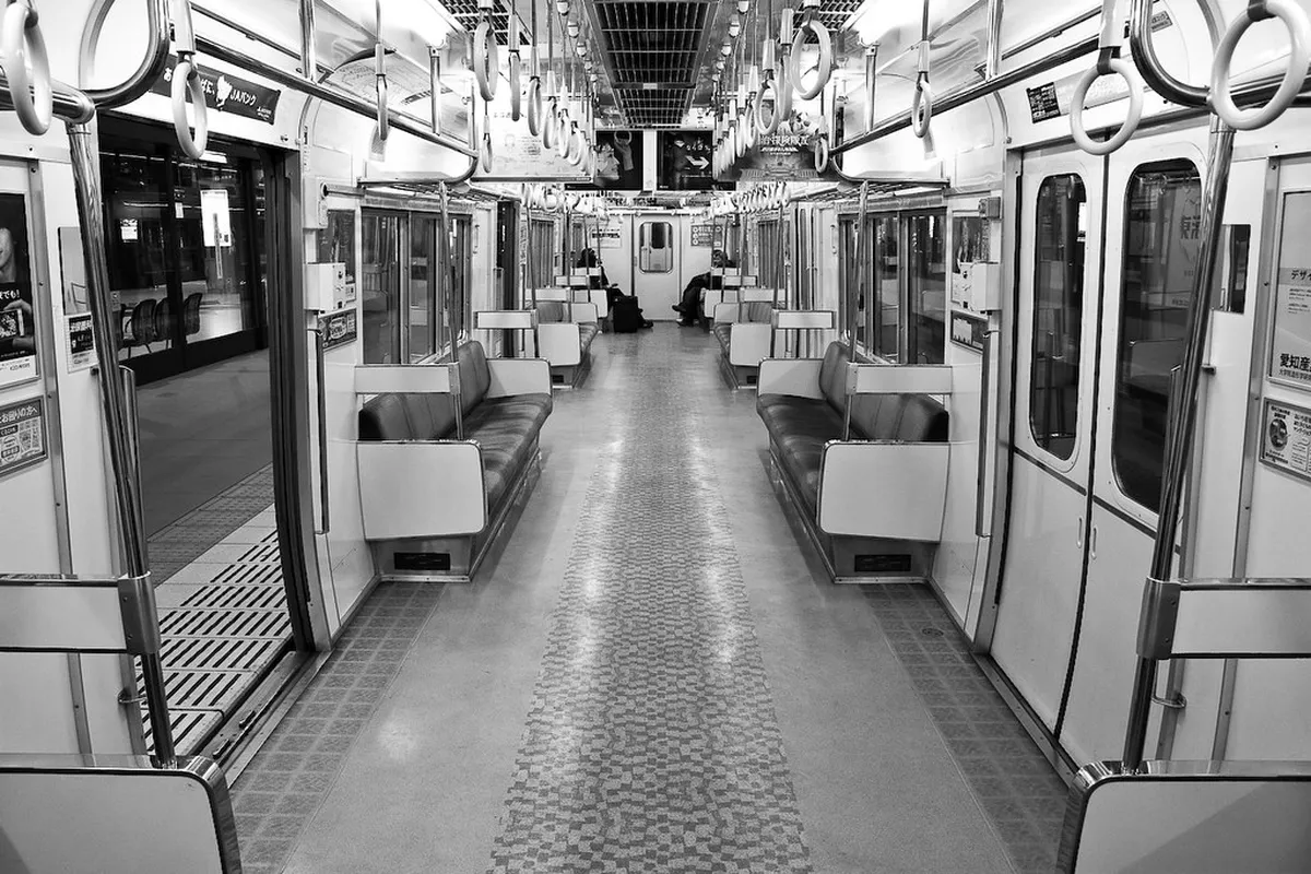 Passengers waiting on a platform of Nagoya's clean and efficient subway system, one of the easiest ways to explore the city in Japan