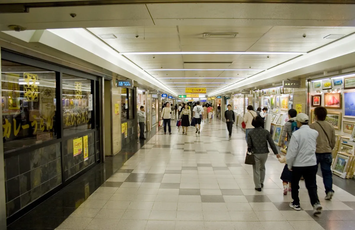 A bustling Japanese department store floor with cosmetics and goods on display, where visitors can claim tax-free shopping in Nagoya, Japan