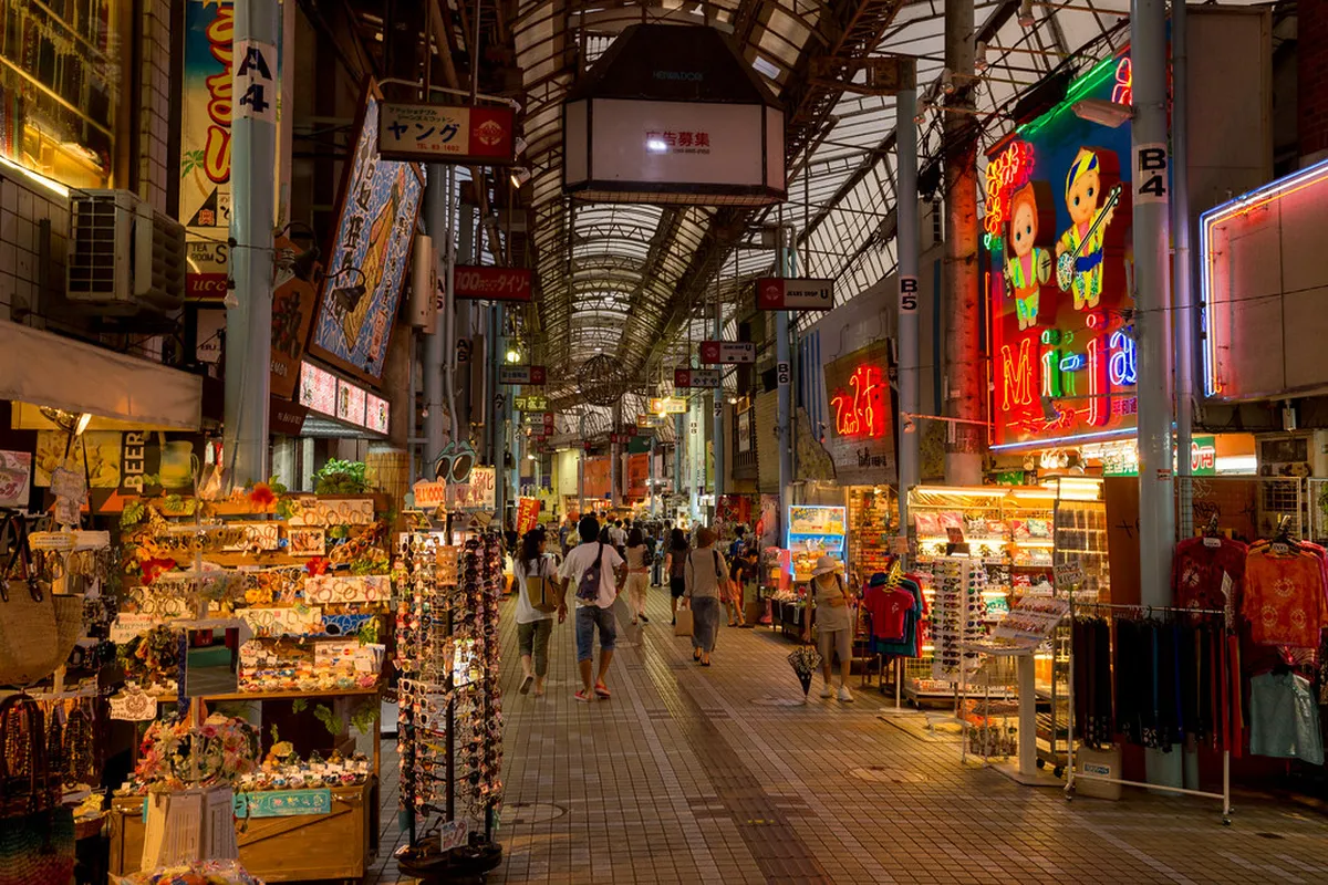 Naha Kokusai Street bustling with visitors and colourful shops in Okinawa Japan