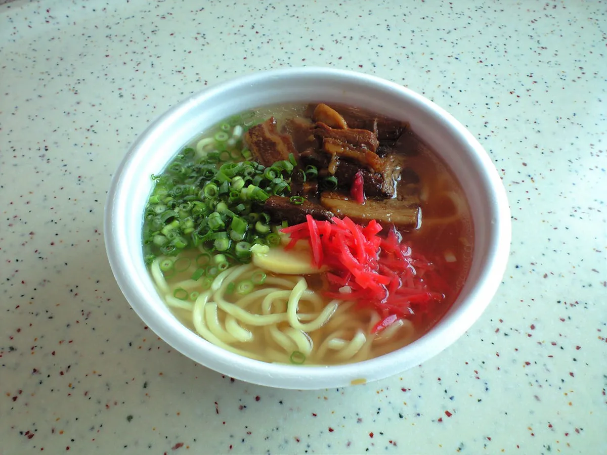 A bowl of Okinawa soba with tender pork ribs and green onions in Naha Japan