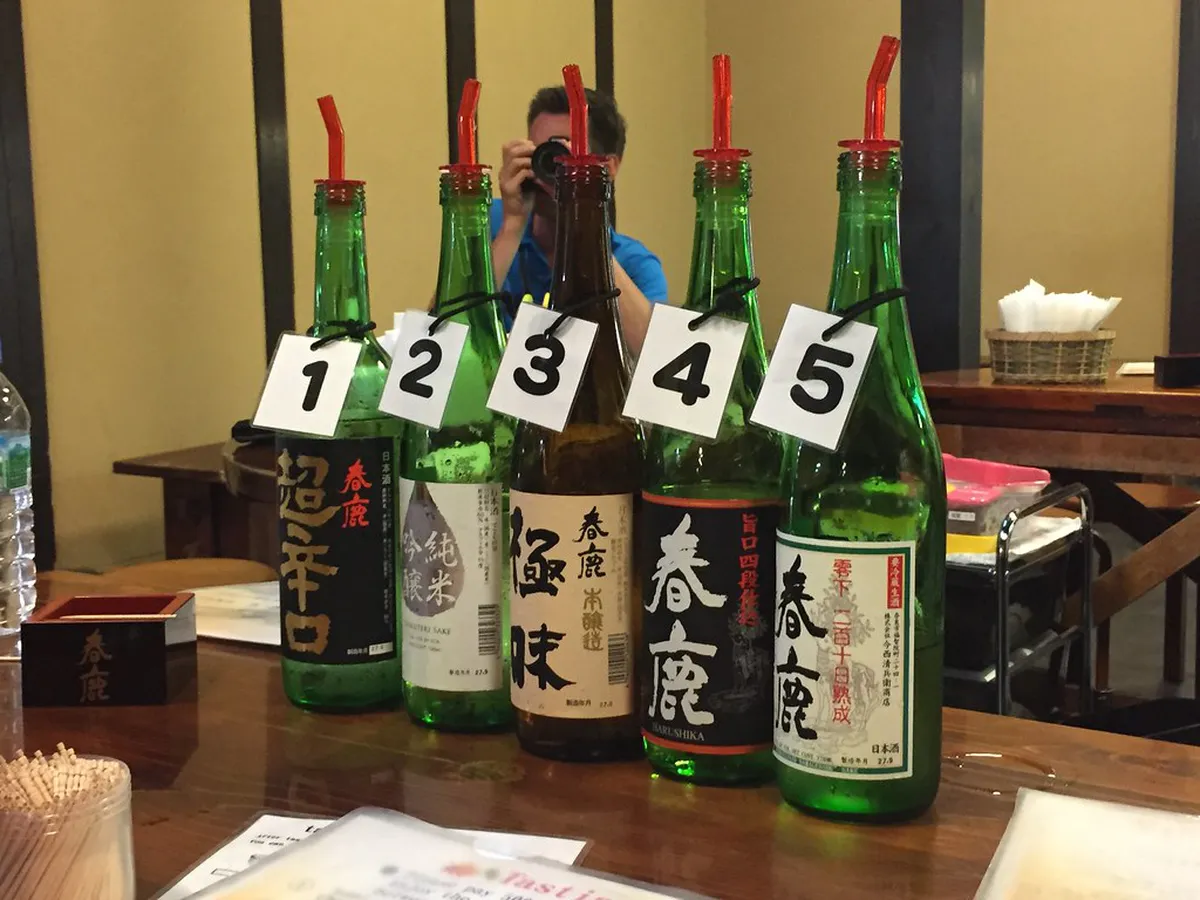 Sake barrels and traditional signage outside the Harushika Brewery in Naramachi, Nara, one of the district's most popular cultural stops in Japan