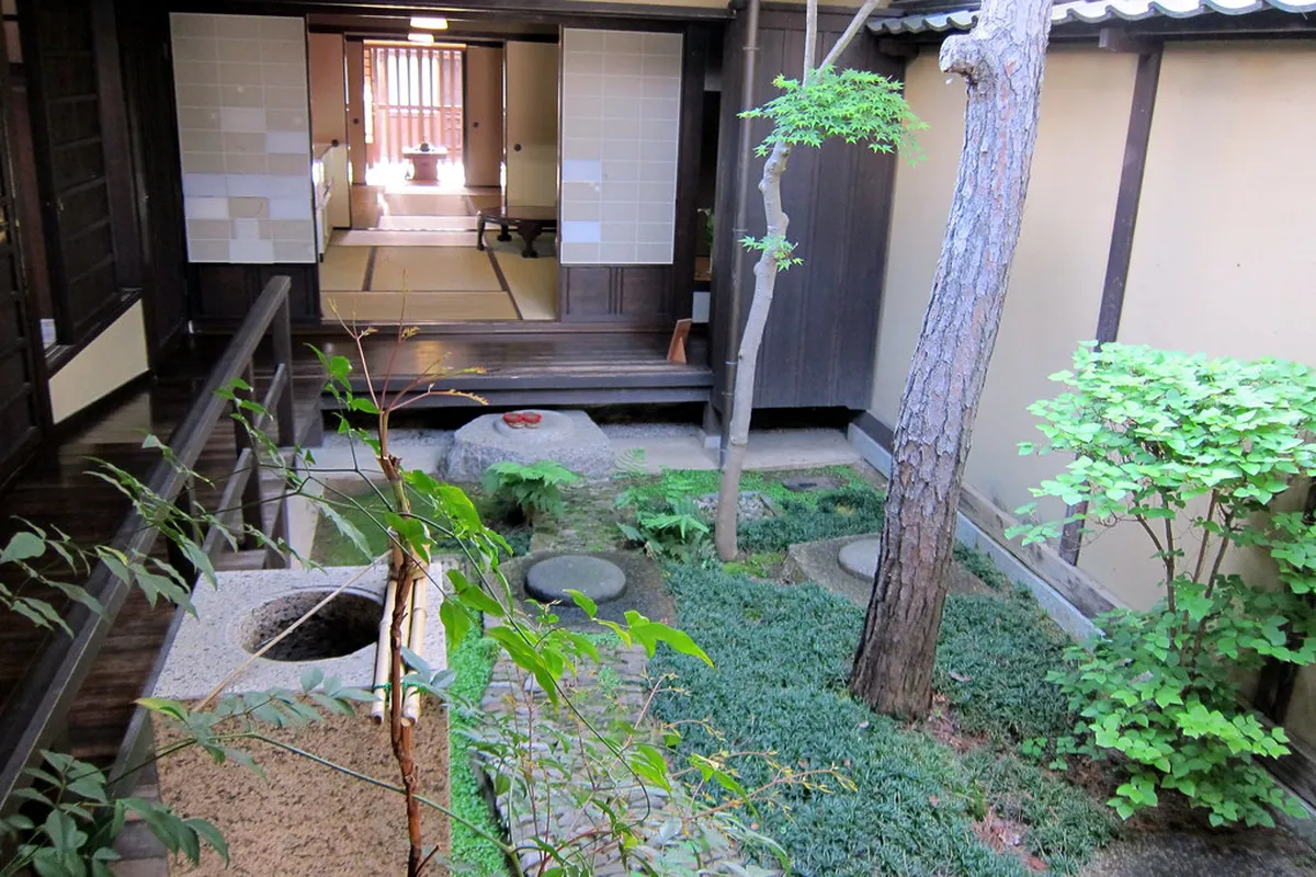 A beautifully preserved machiya merchant townhouse with latticed wooden facade on a quiet lane in Naramachi old town, Nara, Japan