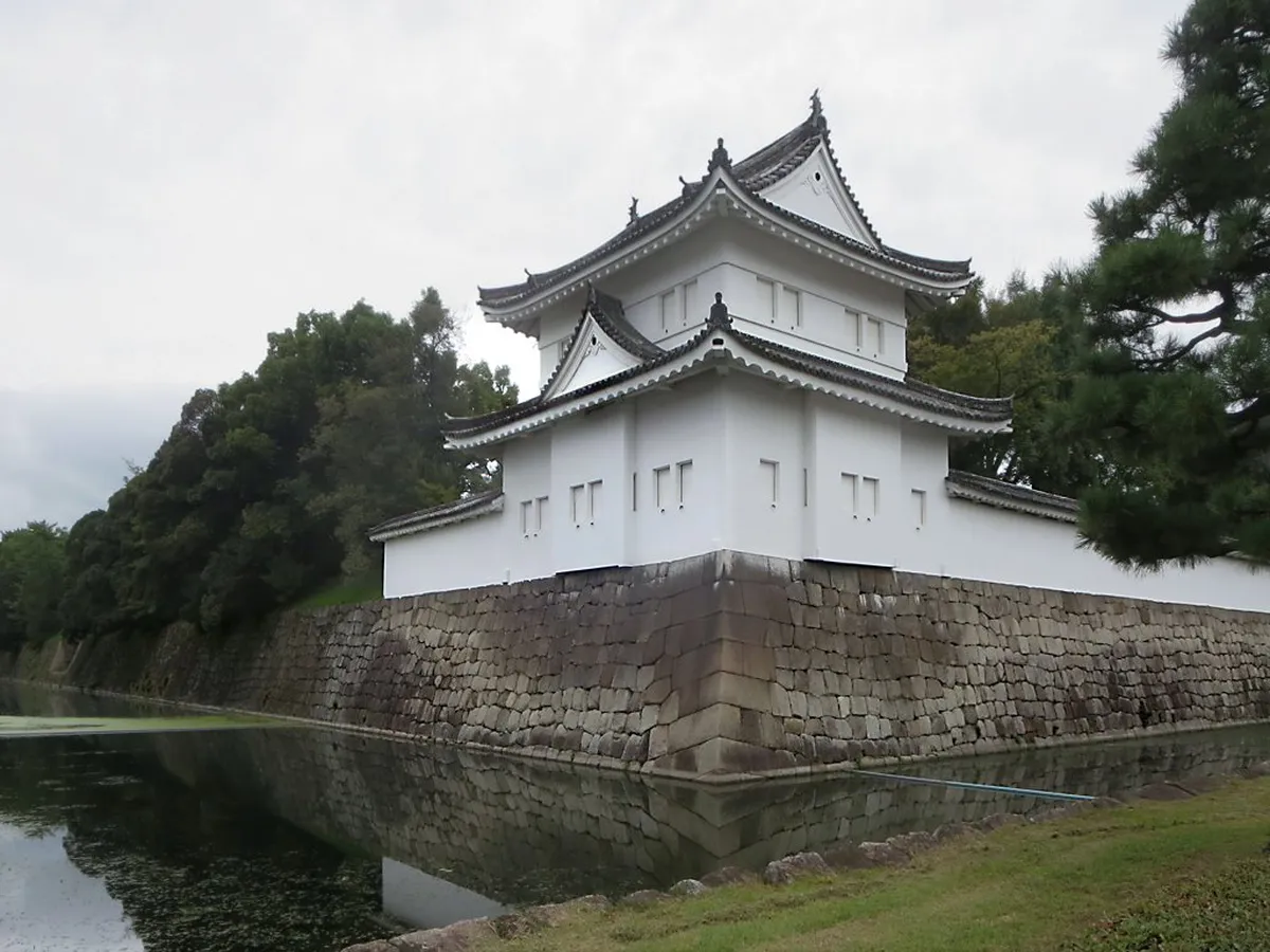 Nijo Castle stone walls and moat in Kyoto showing the Tokugawa shogunate fortress under blue skies