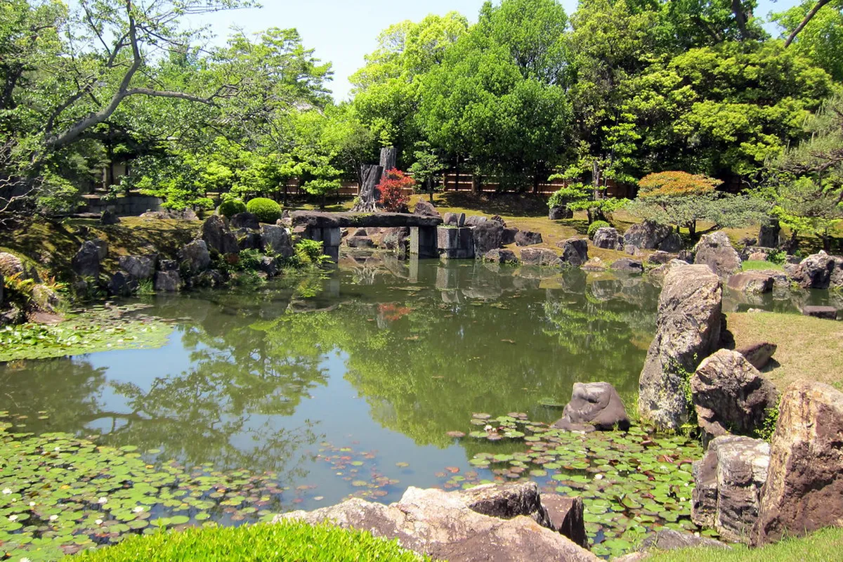 Ninomaru Garden at Nijo Castle Kyoto with stone islands in the central pond and manicured pine trees