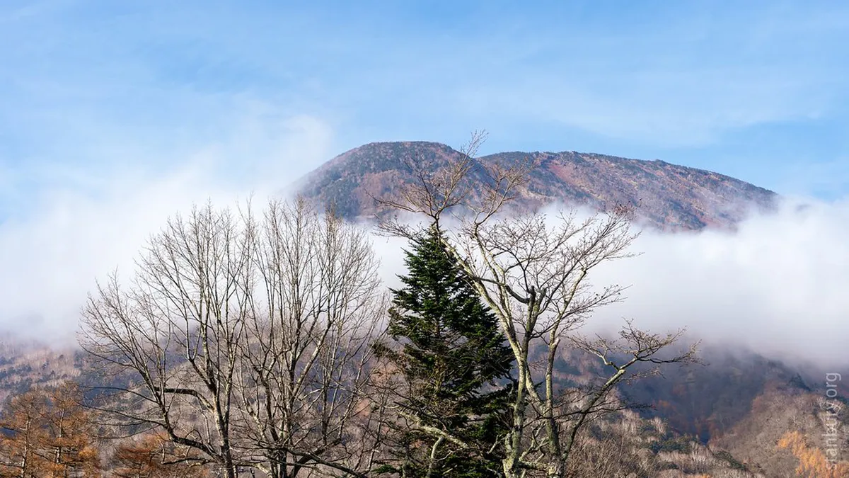 Mount Nantai rising above Lake Chuzenji as seen from a hiking trail in Nikko National Park, Japan