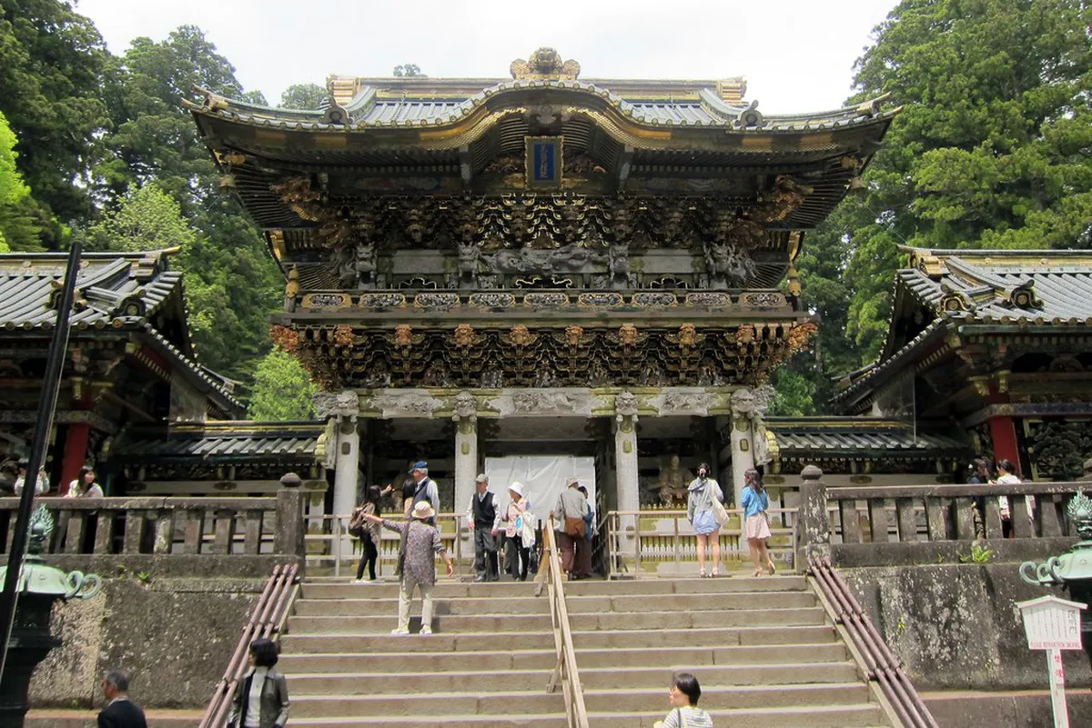 Elaborate vermilion and gold gateway of the UNESCO-listed Toshogu Shrine complex in Nikko, Japan