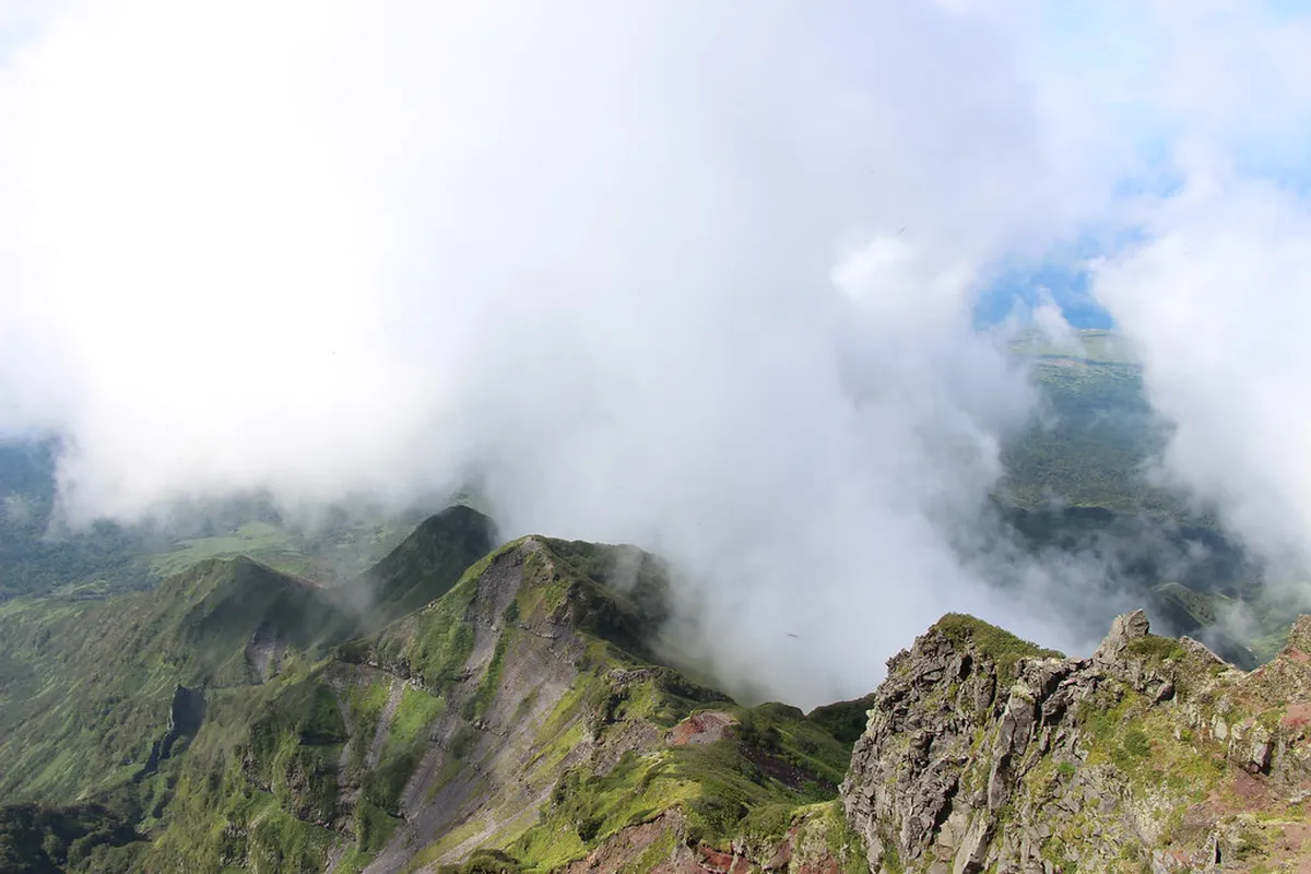 Dramatic mountain landscape with volcanic peaks and forest in Hokkaido, Japan near the Niseko onsen region