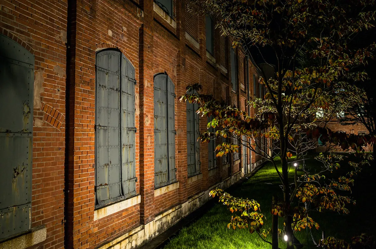 Noritake Garden red-brick factory chimneys and formal garden walkways in Nishi Ward, Nagoya, Japan