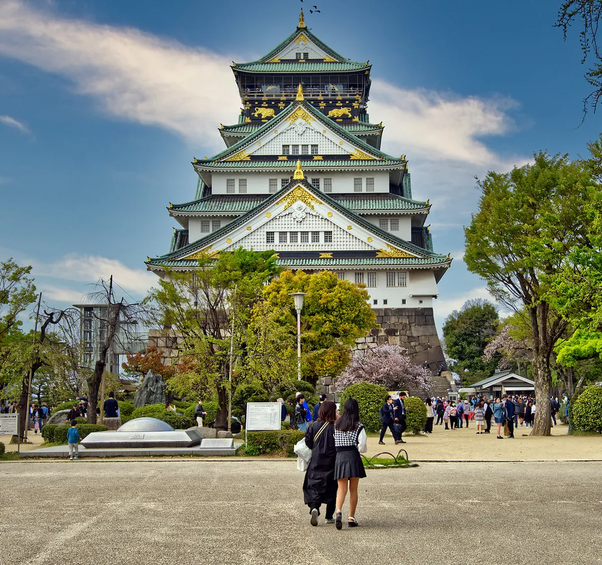 Osaka Castle tower reflected in the surrounding moat, a historic landmark in Osaka, Japan