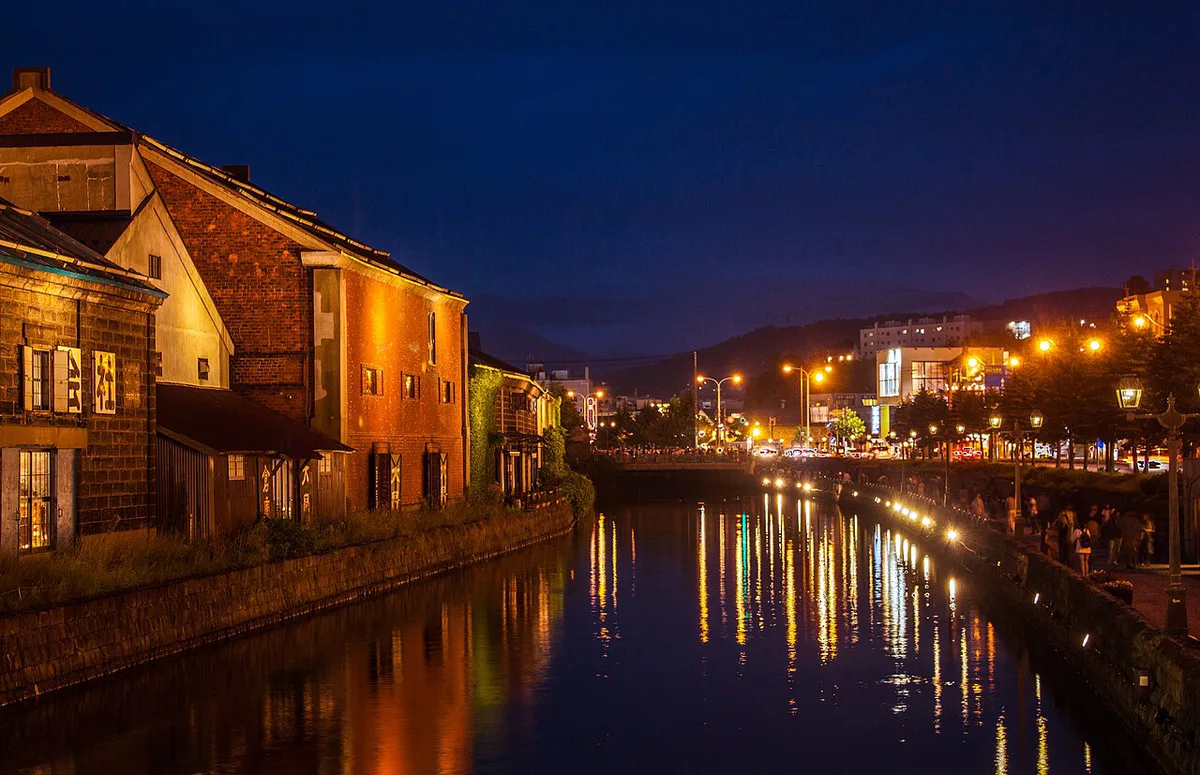 Candle-lit snow lanterns along the Otaru Canal during the Snow Light Path festival, Japan — 2