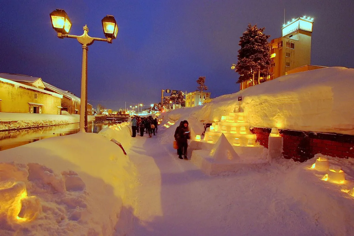 Floating candles and snow lanterns on the Otaru Canal at the Snow Light Path, Japan — 1
