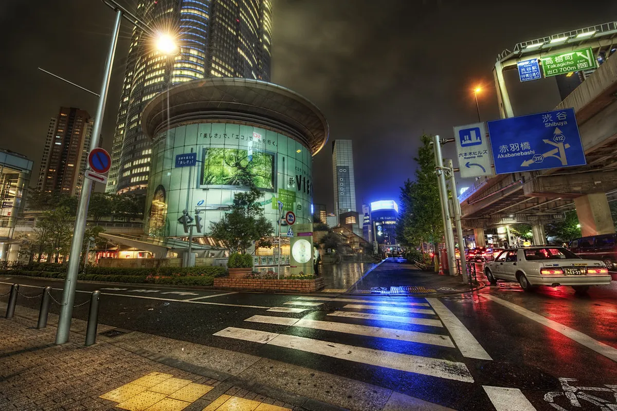 Roppongi neon-lit streets with bars and entertainment venues at night in Tokyo, Japan