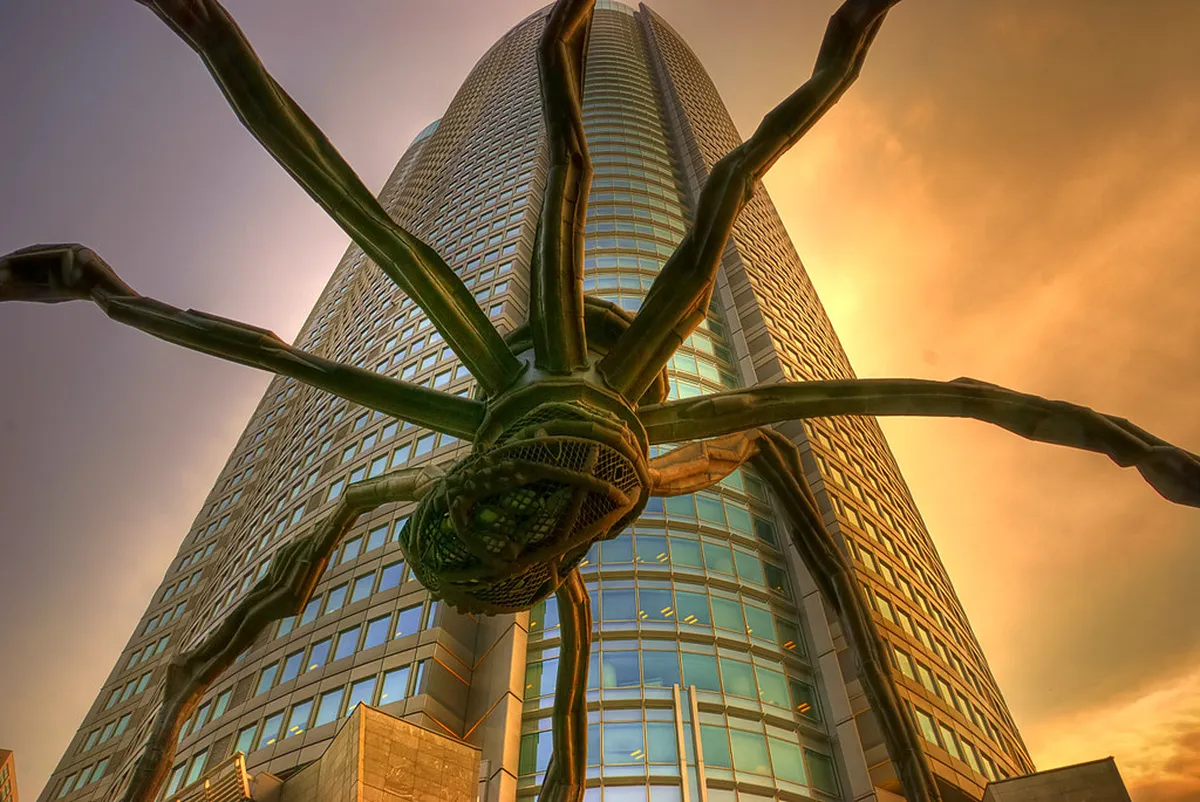 Roppongi Hills Mori Tower and 66 Plaza with the Maman spider sculpture in Tokyo, Japan