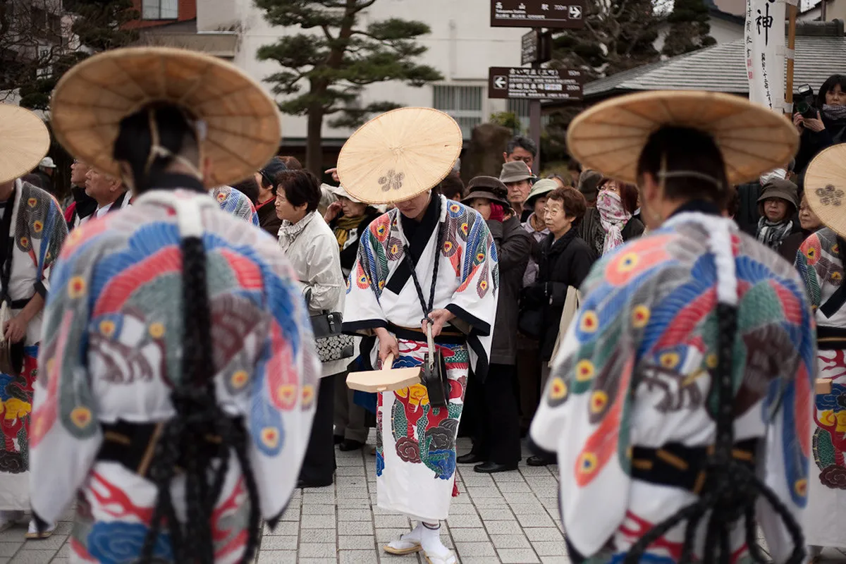 Ornate yatai festival float being paraded through the streets of Takayama during the Hachiman Autumn Festival