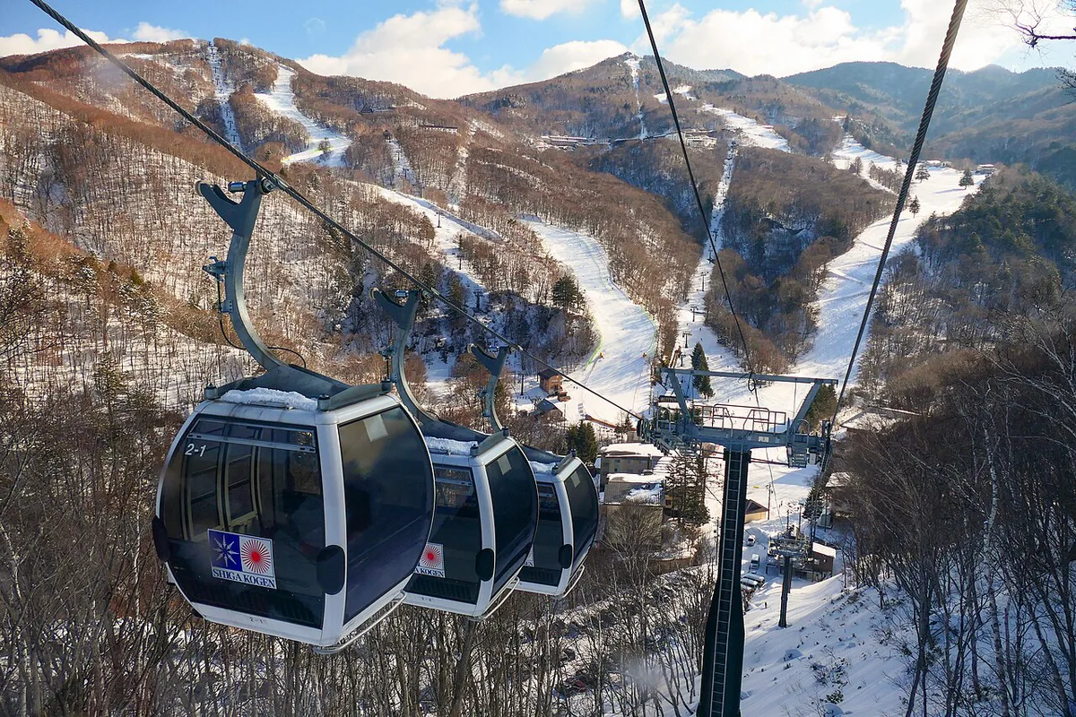 Skiers on the snowy slopes of Shiga Kogen ski area in Nagano, Japan — 1