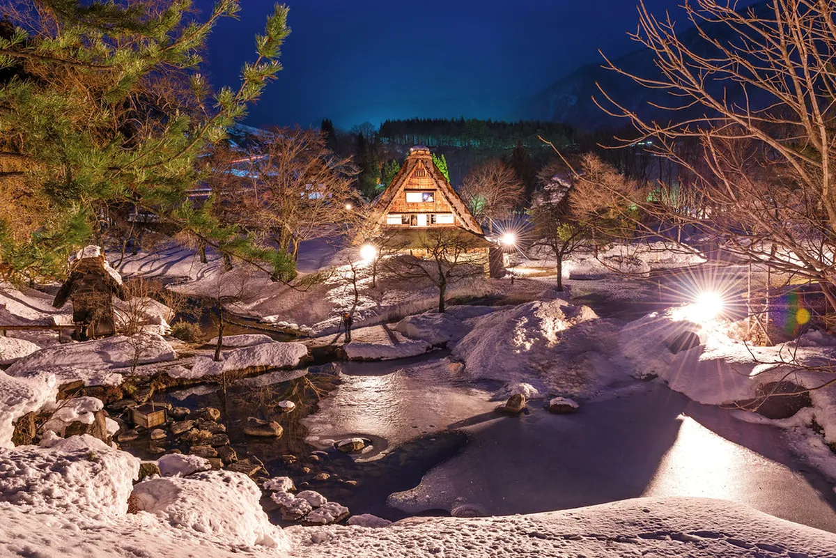 Shirakawa-go winter illumination with glowing gassho-zukuri farmhouses and snow