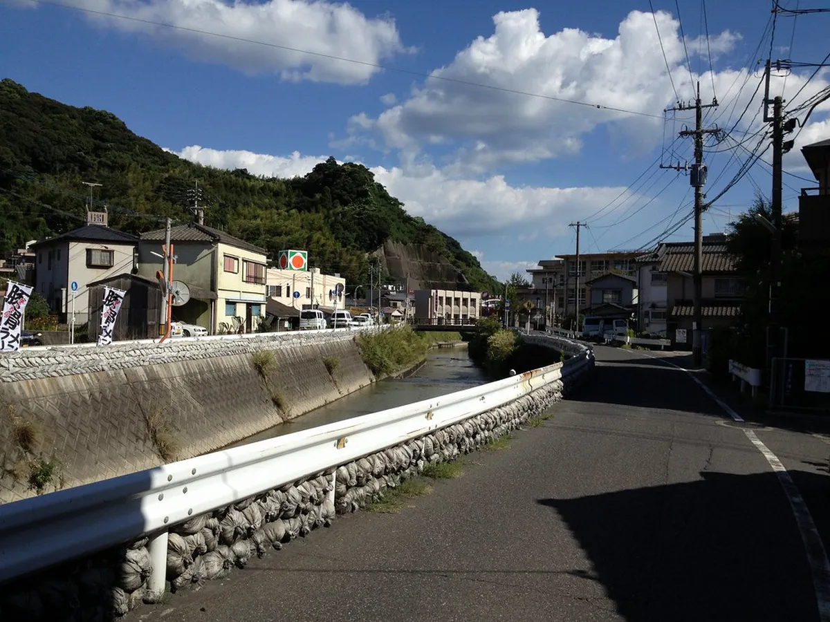 Traditional Japanese street food stall in Kagoshima serving local cuisine to visitors in a lively southern Japan setting