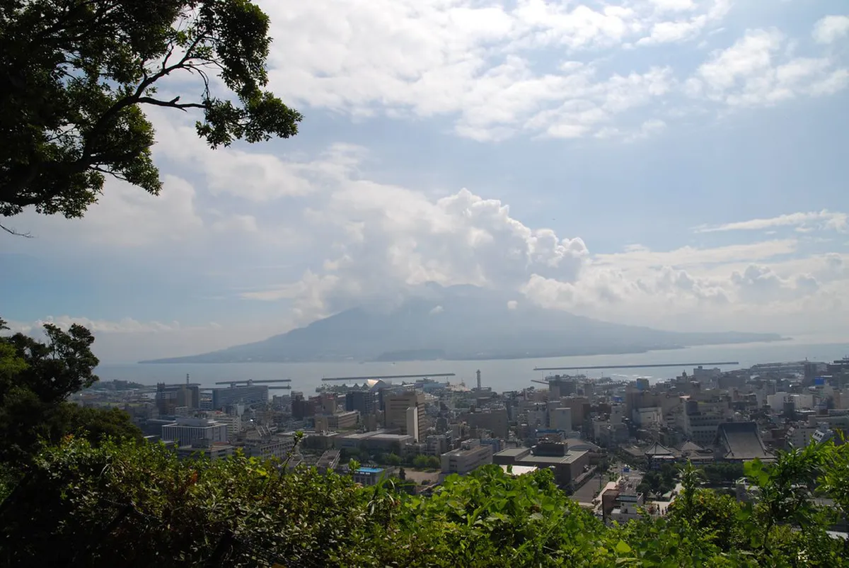 Shiroyama Observatory viewpoint in Kagoshima Japan with Sakurajima volcano and Kinko Bay visible in the distance