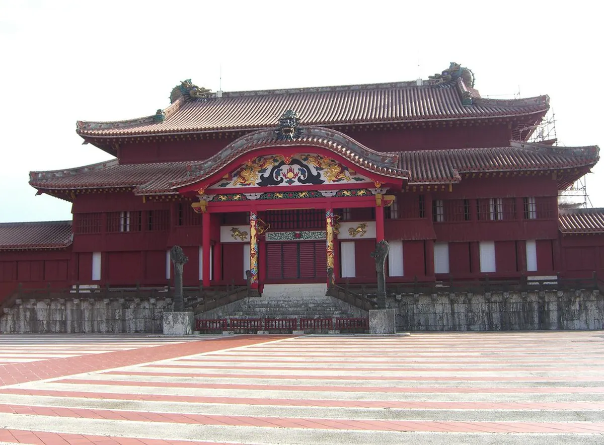 Shuri Castle's striking red lacquer architecture set against the sky, reflecting the Ryukyu Kingdom heritage in Naha, Okinawa