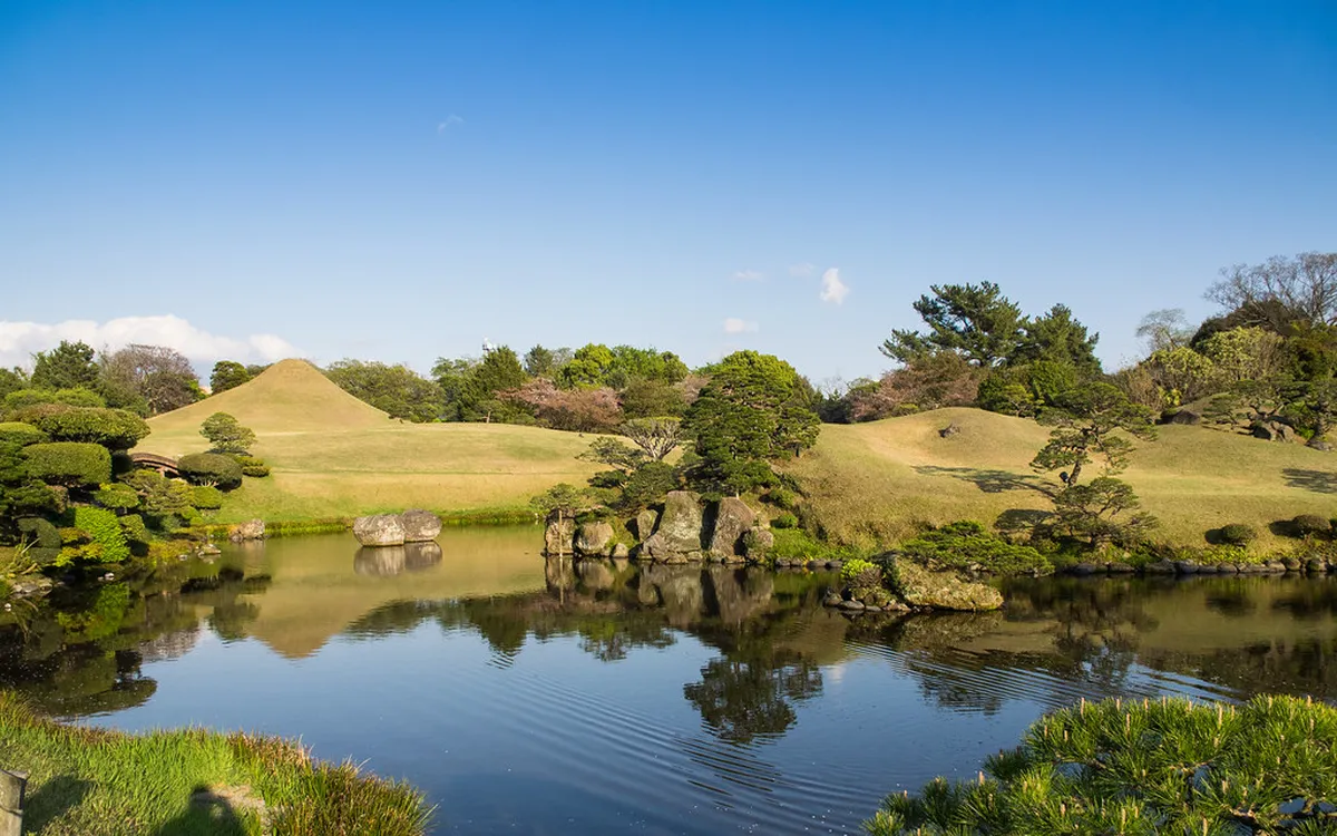 Izumi Shrine nestled among pine trees inside Suizenji Garden grounds in Kumamoto, Japan