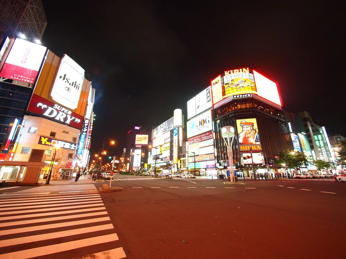 Susukino district street scene with traditional Japanese buildings and signage in central Sapporo Hokkaido Japan