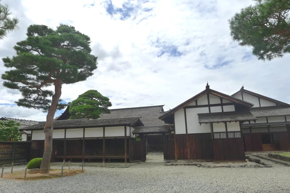 Traditional Japanese garden viewed through open sliding doors at Takayama Jinya government office in Gifu Prefecture