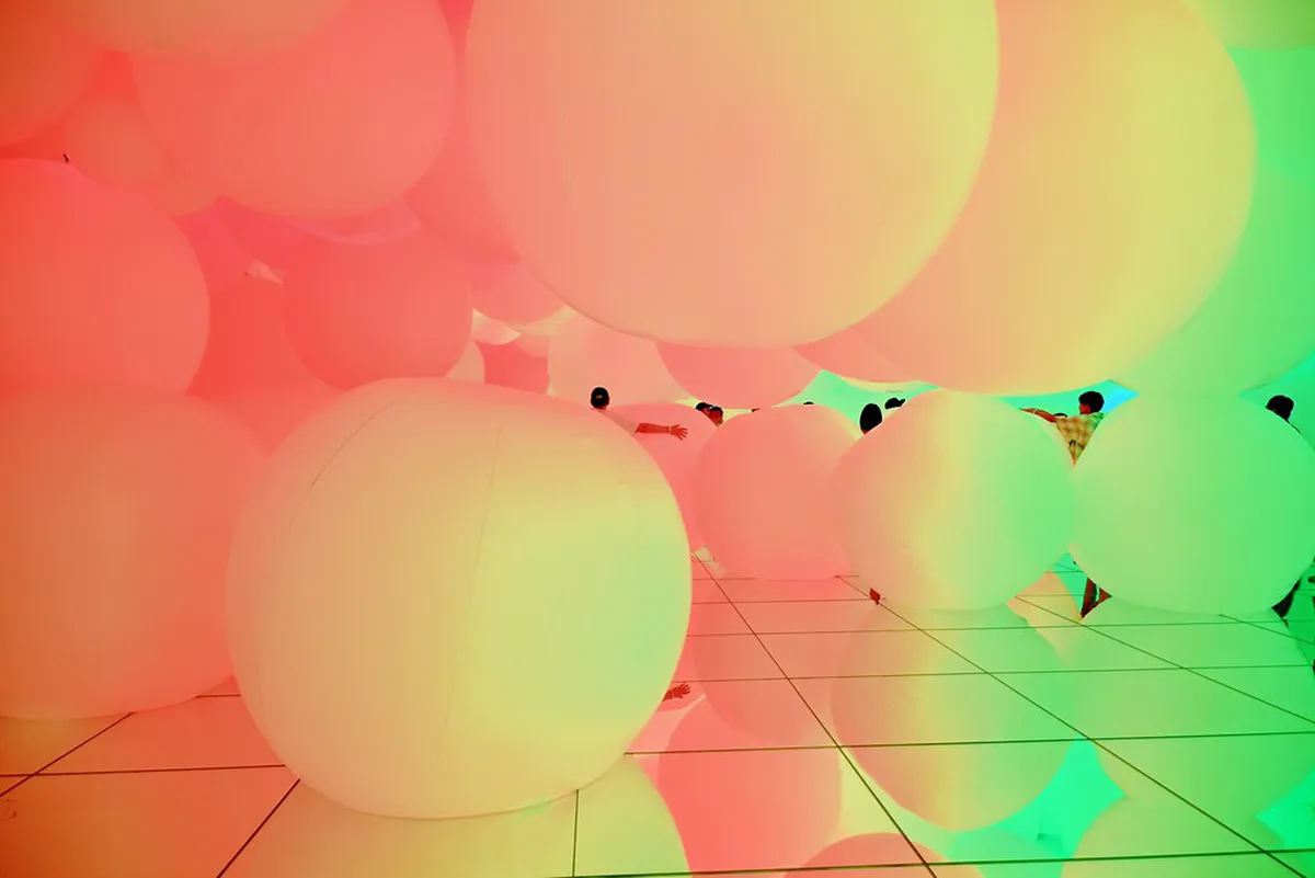 teamLab Planets Tokyo immersive digital art installation with mirror floors and LED light displays in Japan