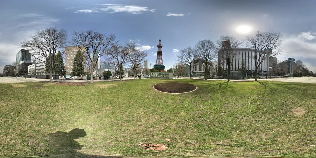 Sapporo TV Tower standing at the eastern end of Odori Park with the city stretching behind it in Hokkaido, Japan