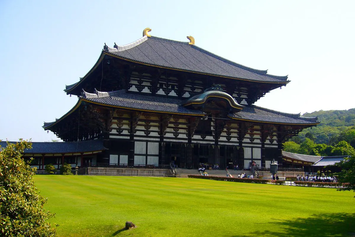 The colossal Great Buddha Hall of Todai-ji Temple in Nara, Japan, with its sweeping wooden roof and surrounding park