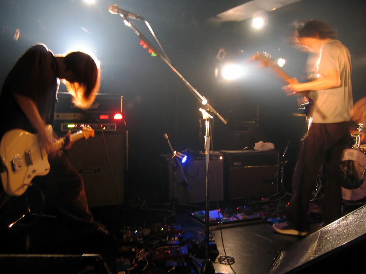 Intimate live music venue in Shimokitazawa neighborhood with performers on stage in Tokyo, Japan