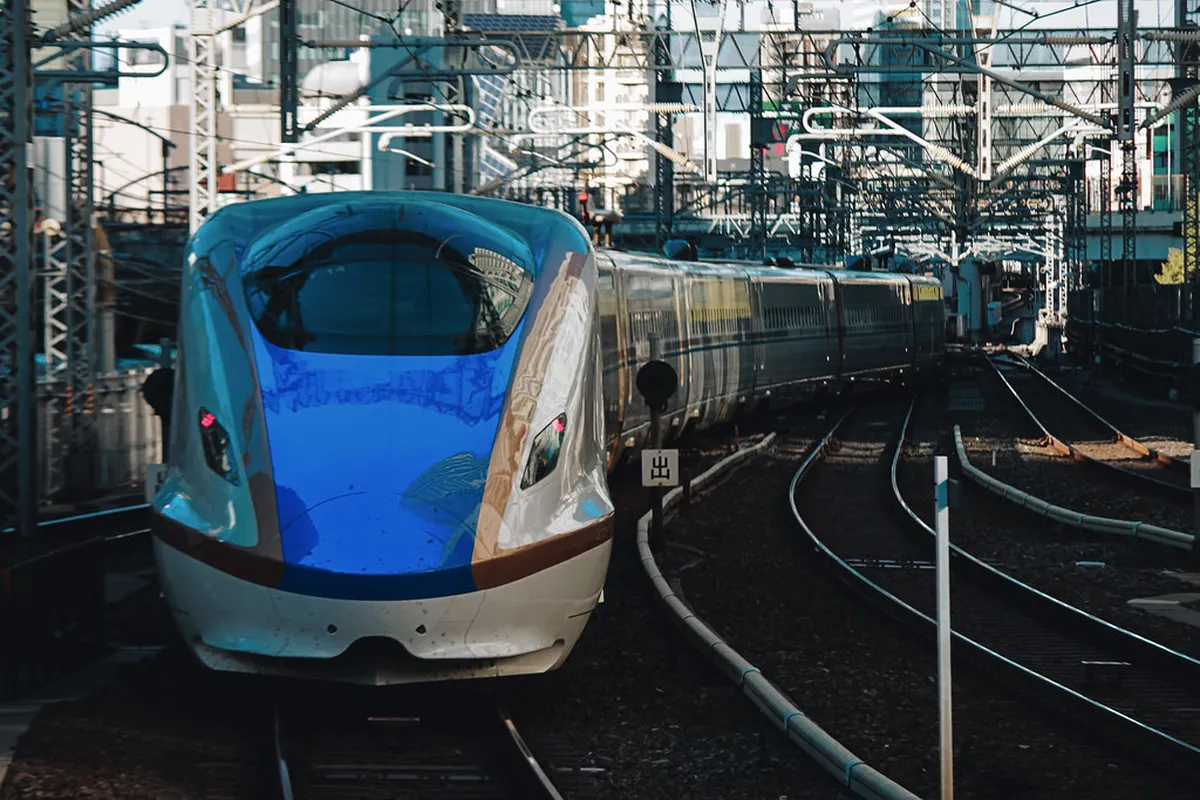 Hokuriku Shinkansen bullet train at platform in Japan