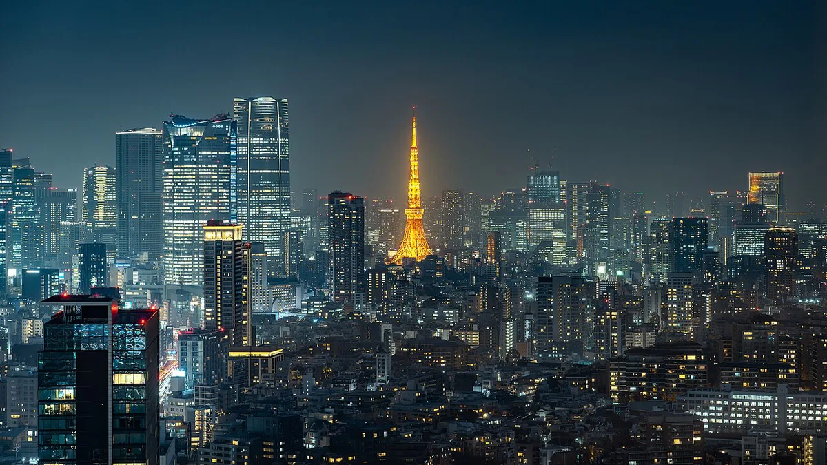 Tokyo Tower illuminated in orange light against the night sky, Japan — 2