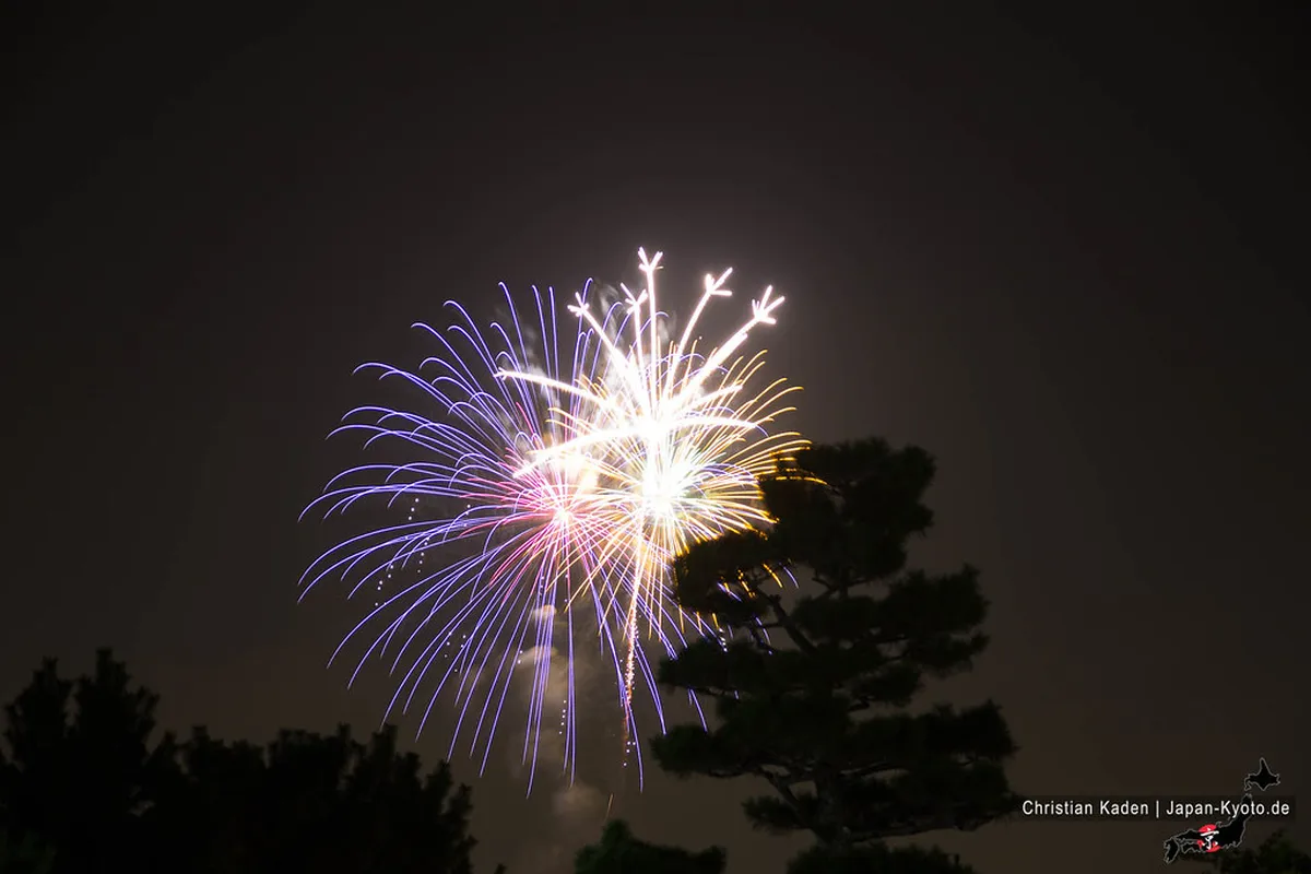 Japanese summer festival fireworks bursting over the night sky in a spectacular display, Japan