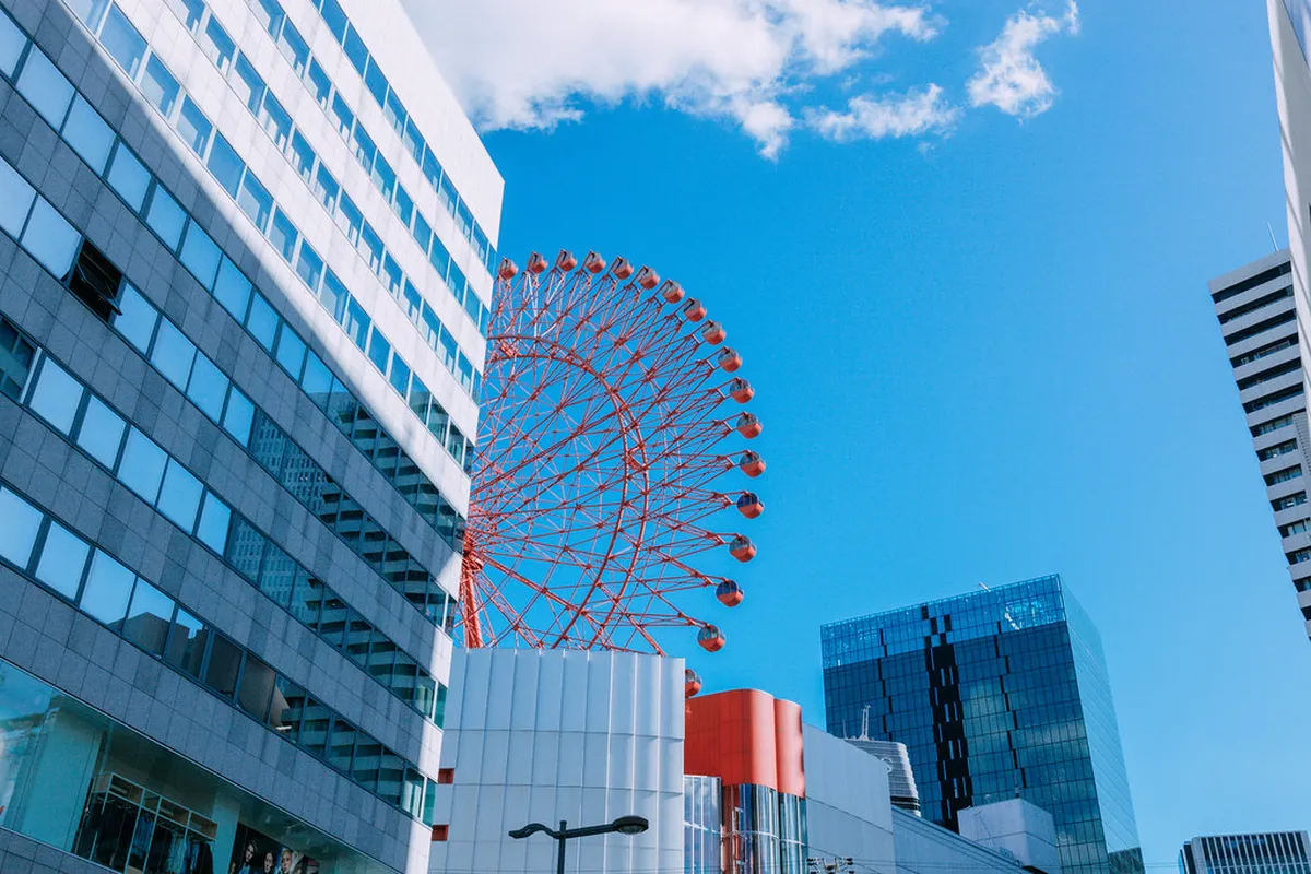 Umeda Sky Building's twin towers rising above the Osaka skyline with their distinctive circular rooftop bridge