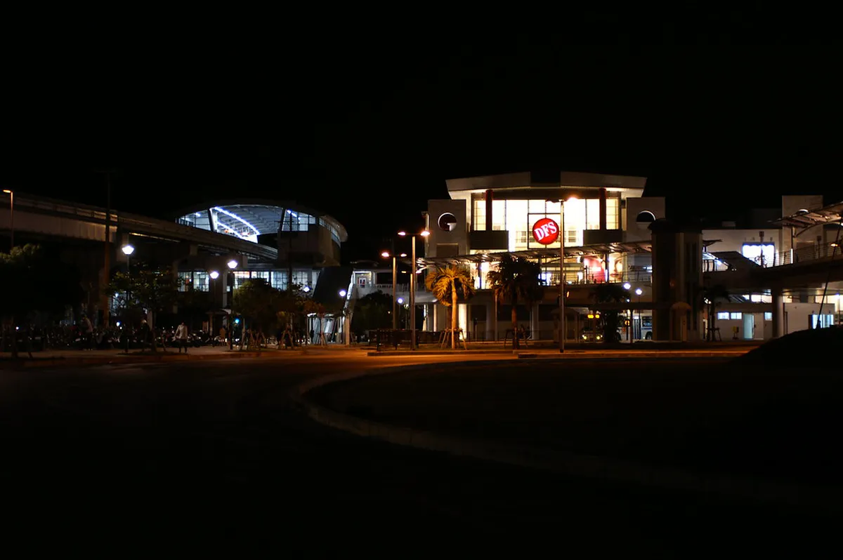 Wide shopping street in Omoromachi modern district with palm trees in Naha, Okinawa, Japan