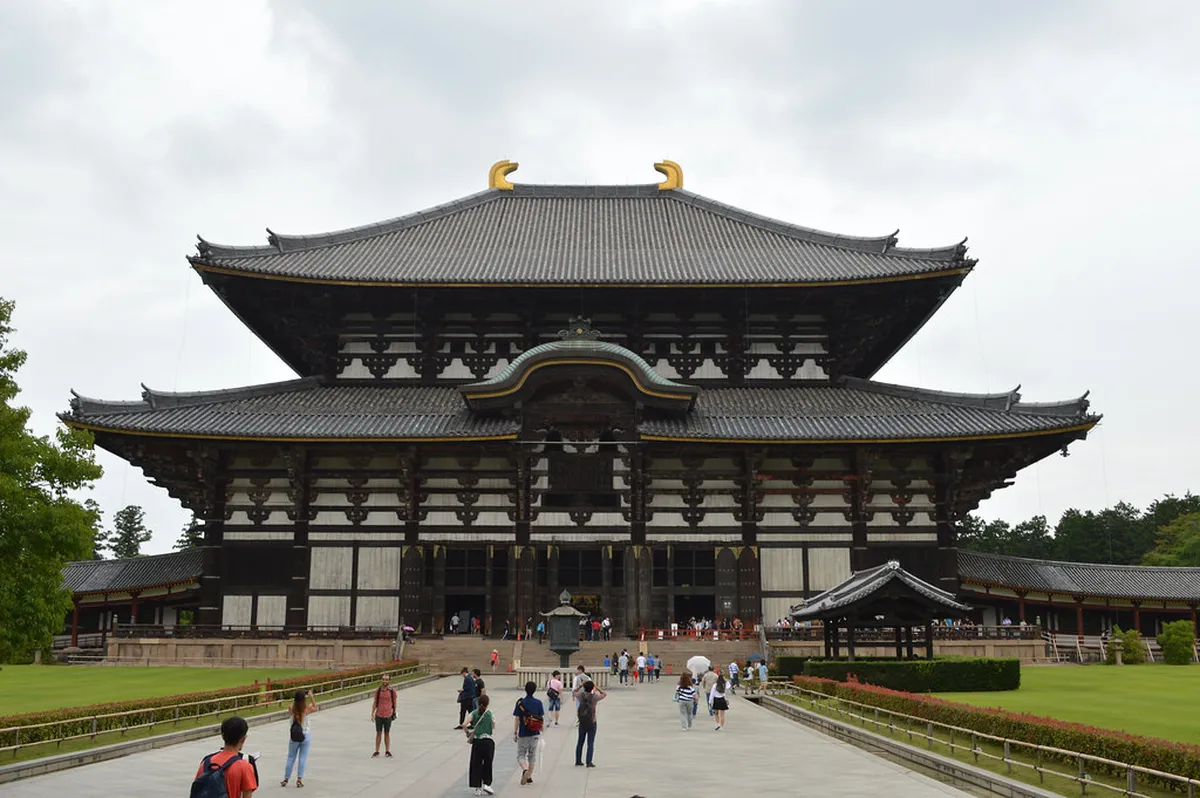 Todaiji Temple Daibutsuden great hall and Nandaimon gate rising above the cedar forest in Nara, Japan