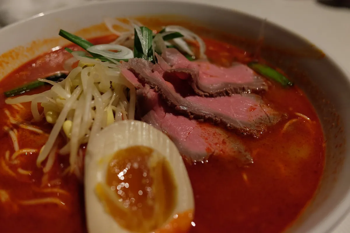 Yokohama ramen bowl with rich broth and toppings, served at a traditional noodle restaurant in Japan
